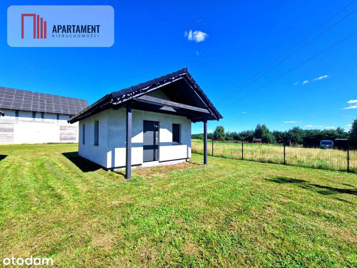 Budynek mieszkalny z domkami rekreacyjnymi.-18