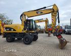 Caterpillar M 318 / z Niemiec / Tylko 10400 mth / - 10