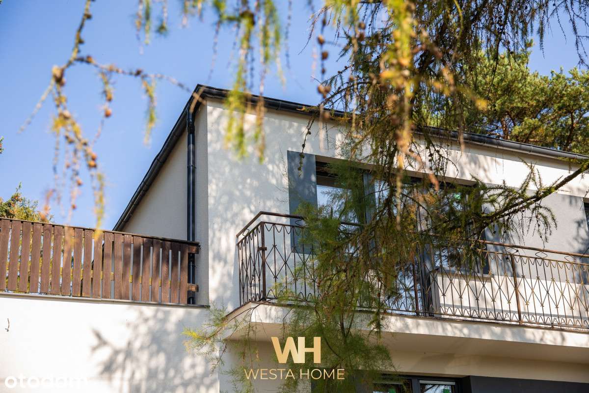 Dom wolnostojący w otoczeniu drzew. Zakroczym.-2