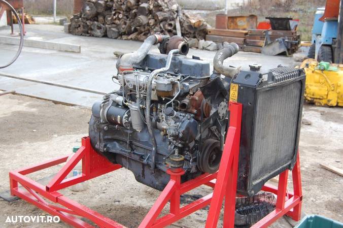 Motor buldoexcavator NEW HOLLAND - FIAT HITACHI - 1
