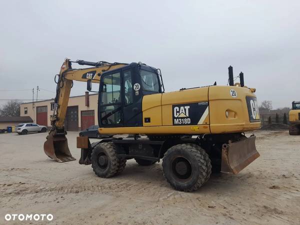 Caterpillar M318D - 4