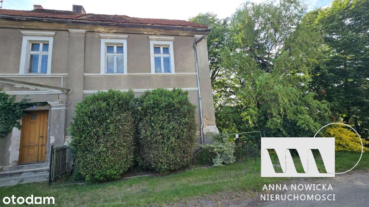 Dom z dużą działką, ogrodem i zabudowaniami gospodarczymi