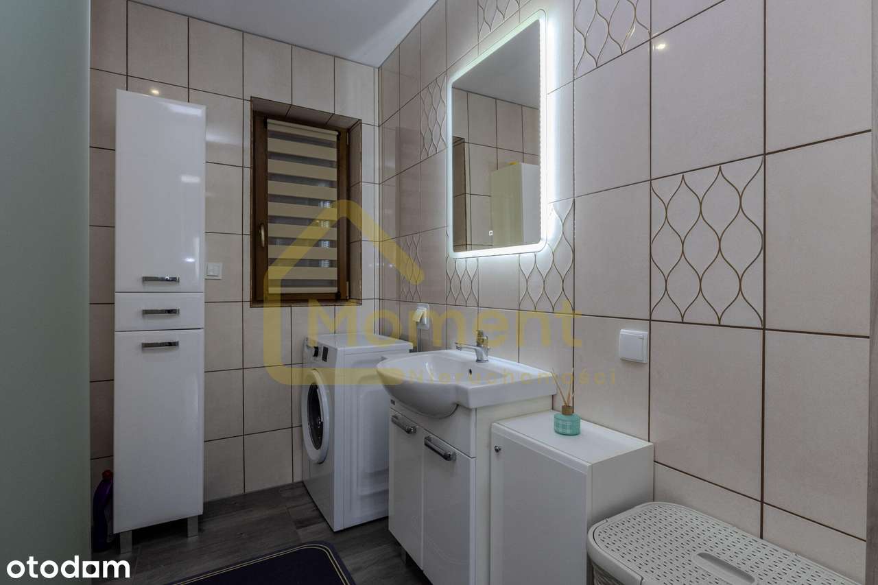 Ekonomiczny dom z garażem i pięknym ogrodem-16