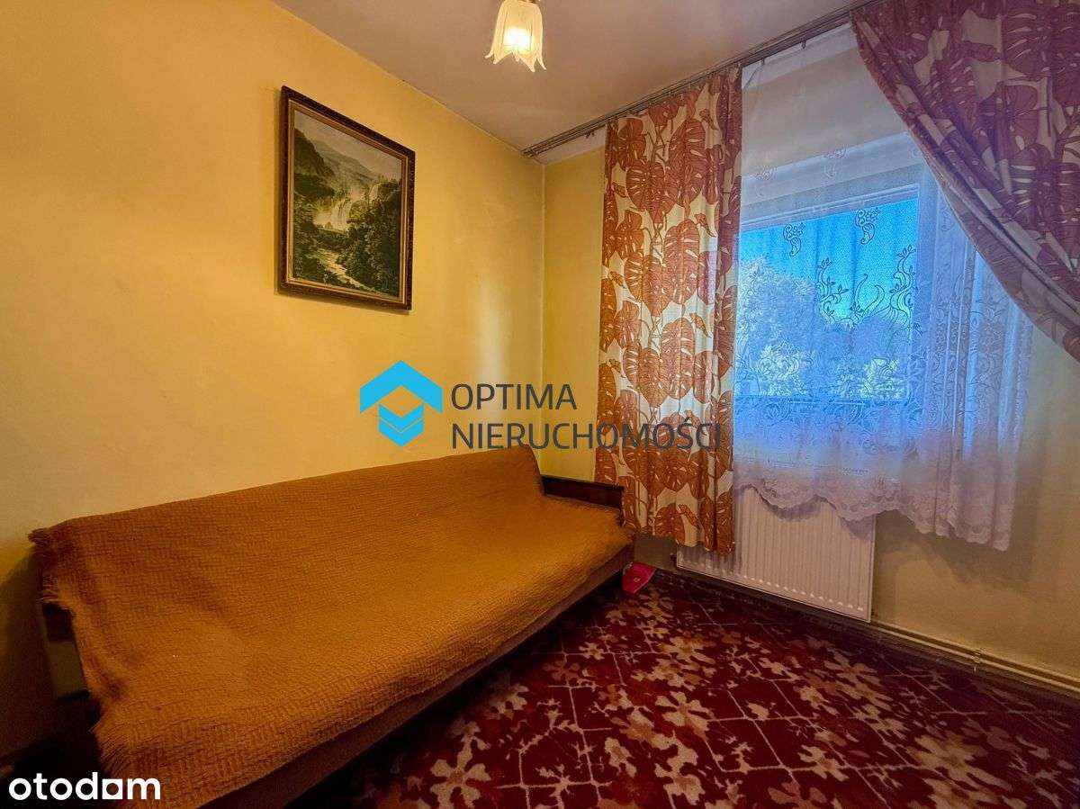 Dom z potencjałem w spokojnej dzielnicy-17