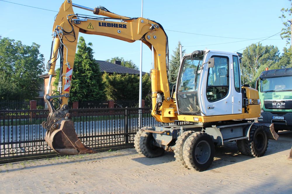 Liebherr Koparka kołowa liebherr a 311 z niemiec 2011