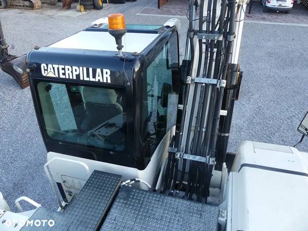 Caterpillar CAT M316D z Niemiec / 12.700mtg / - 27