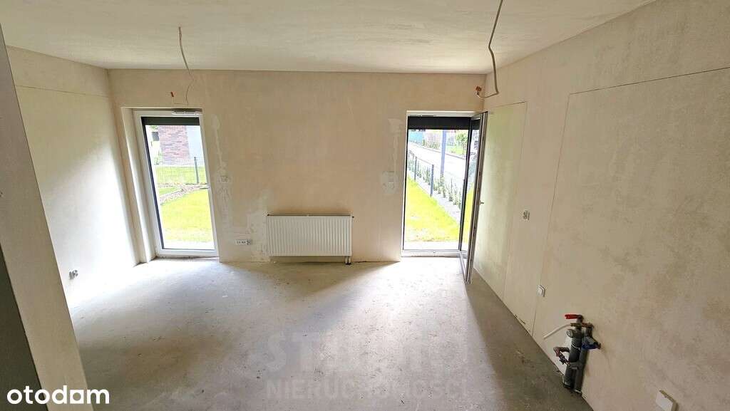 Z ogródkiem 1 pok. Stan deweloperski Garaż-4