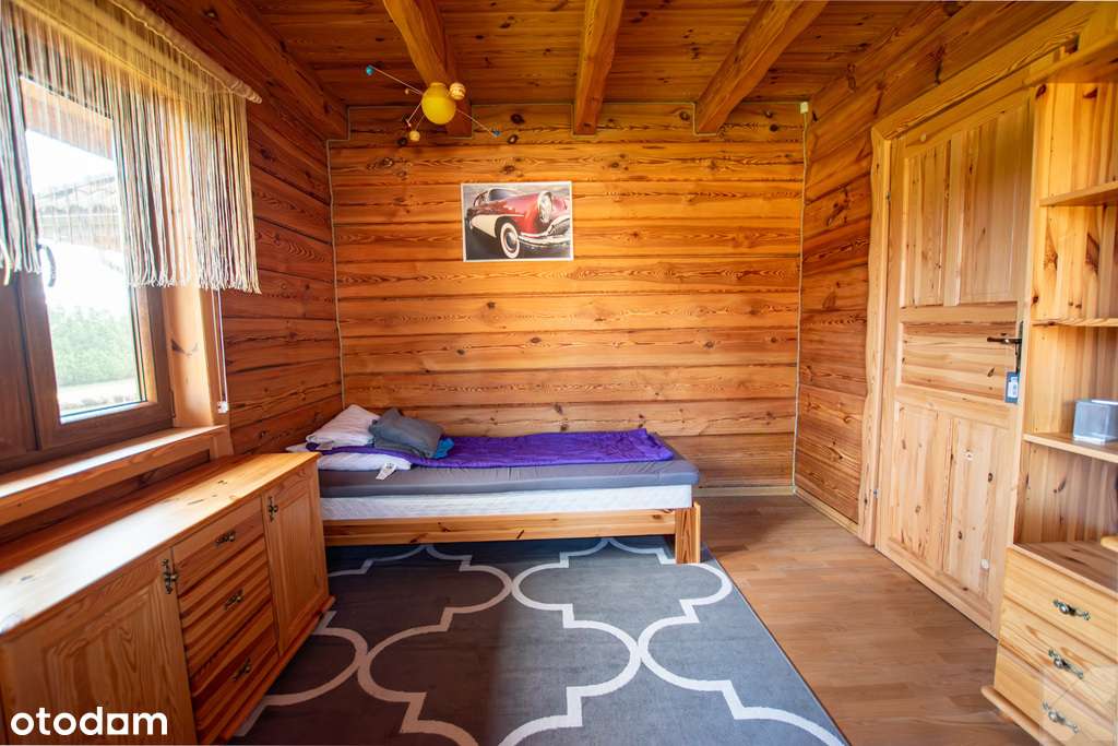 Dom z pełnego bala z zarybionym stawem-14