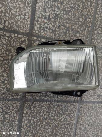 LAMPA REFLEKTOR SILNICZEK LEWA PRZEDNIA MAZDA 121 - 1