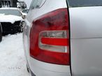 SKODA OCTAVIA II LAMPA LEWA TYLNA LEWY TYŁ W BŁOTNIK KOMBI - 1