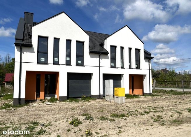 Duży dom z garażem i miejscami postojowymi w cenie