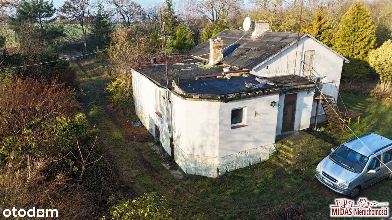 Dom do remontu na ładnej działce-4