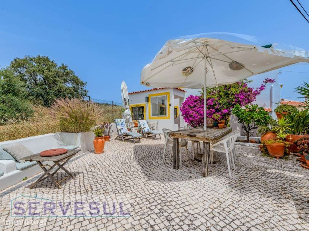 Charmosa moradia de 2 quartos de 121 m², inserida num terreno com 2...-34
