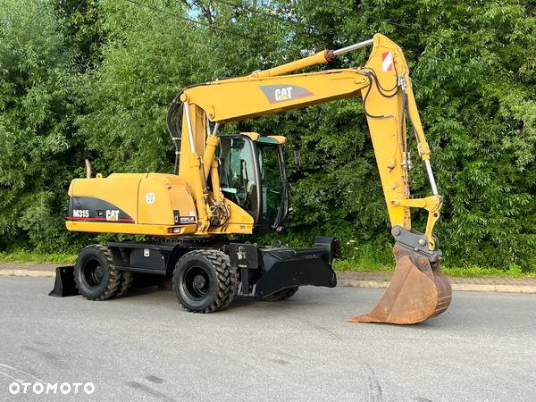 Caterpillar CAT M315C  CATERPILLAR SPROWADZONY  Bardzo Dobry Stan - 2