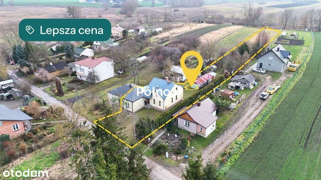 Dom przy spokojnej ulicy, nad rzeką.