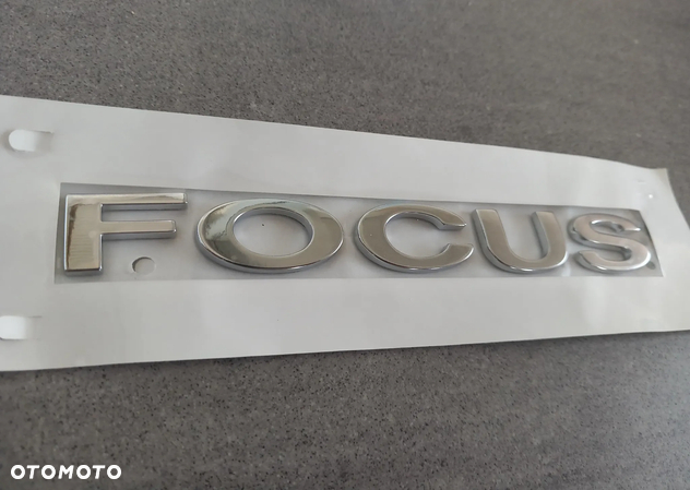 Emblemat znaczek Ford tył napis Focus 2004/Focus C-Max 2003-2007, Focus 2008-2011 1722097 - 2