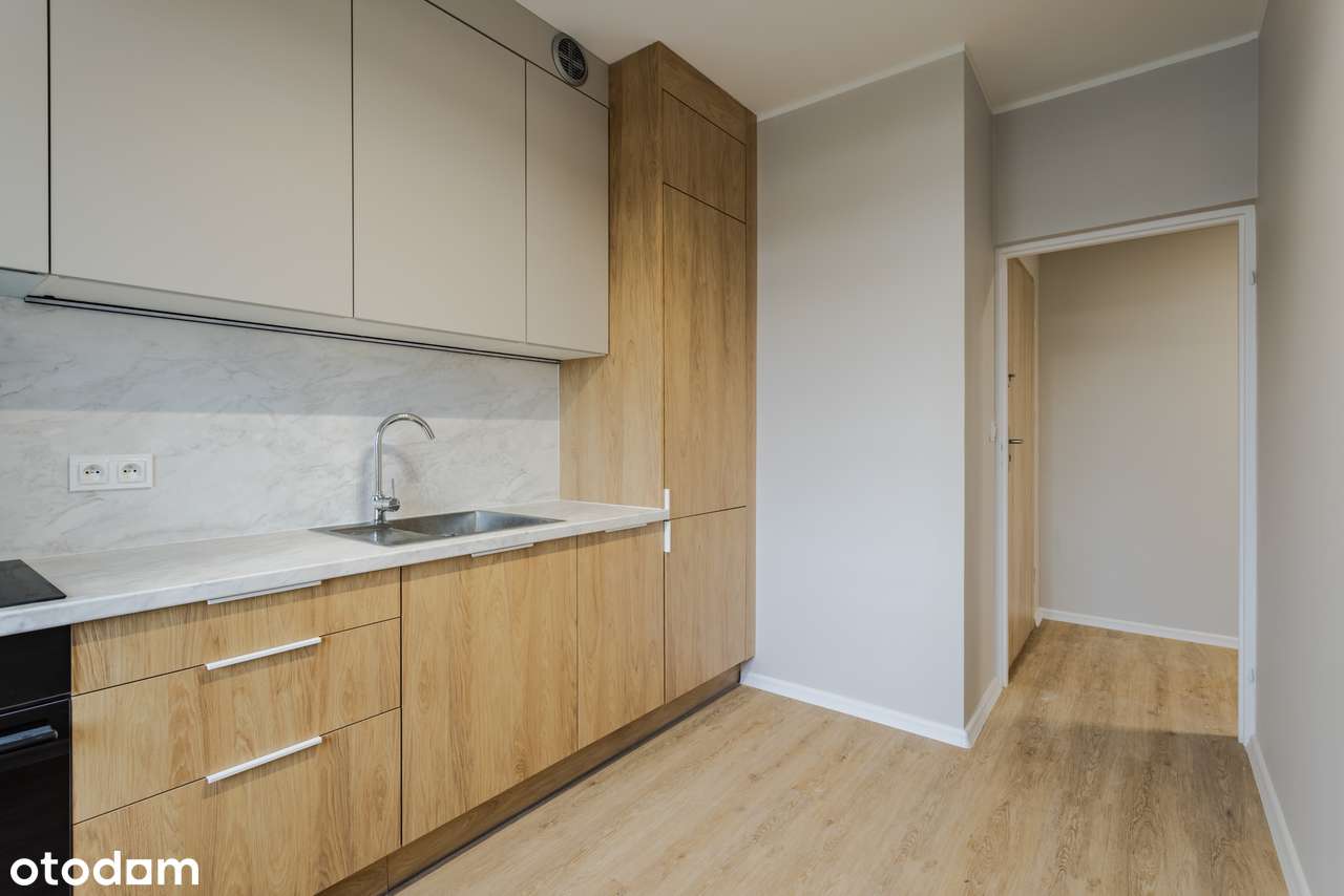Nowa kawalerka z dużą łazienką, osobną kuchnią i komórką lokatorską-1