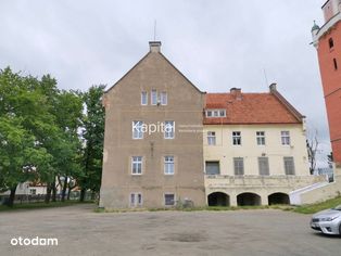 Budynek usługowy z pokojami do wynajęcia