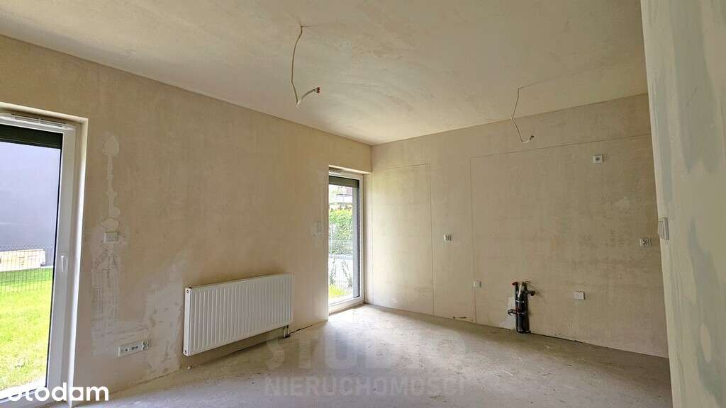 Z ogródkiem 1 pok. Stan deweloperski Garaż-5