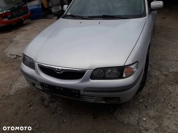 Mazda 626 GF GW 97-02   Maska lampa zderzak pas atrapa 18G 22V - 5