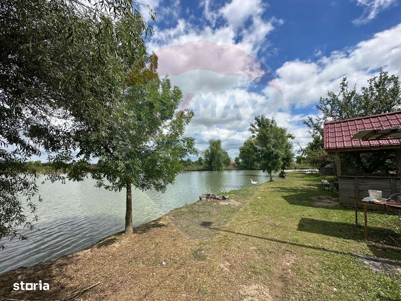 3.7 ha TEREN INTRAVILAN cu CASA si  BALTA PESTE - Imagine principală: 2/9