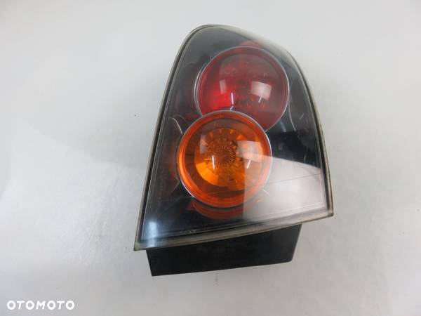 LAMPA LEWA TYLNA MAZDA 3 - 4