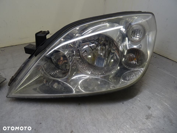 NISSAN PRIMERA P12 KOMBI 02-07 REFLEKTOR LAMPA LEWY PRZÓD - 1