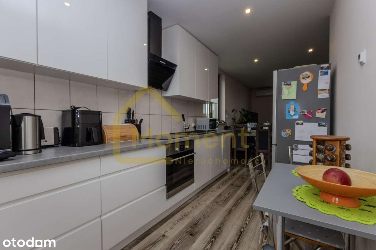 Ekonomiczny dom z garażem i pięknym ogrodem-8