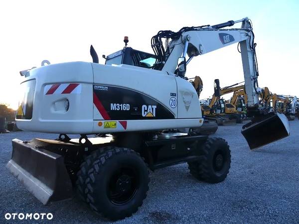 Caterpillar CAT M316D z Niemiec / 12.700mtg / - 11