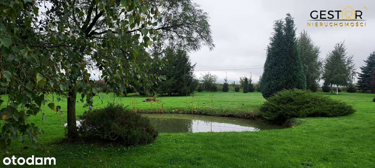 Dom z pięknym ogrodem i stawem_działka 5 739 m²_taras_pompa ciepła-13