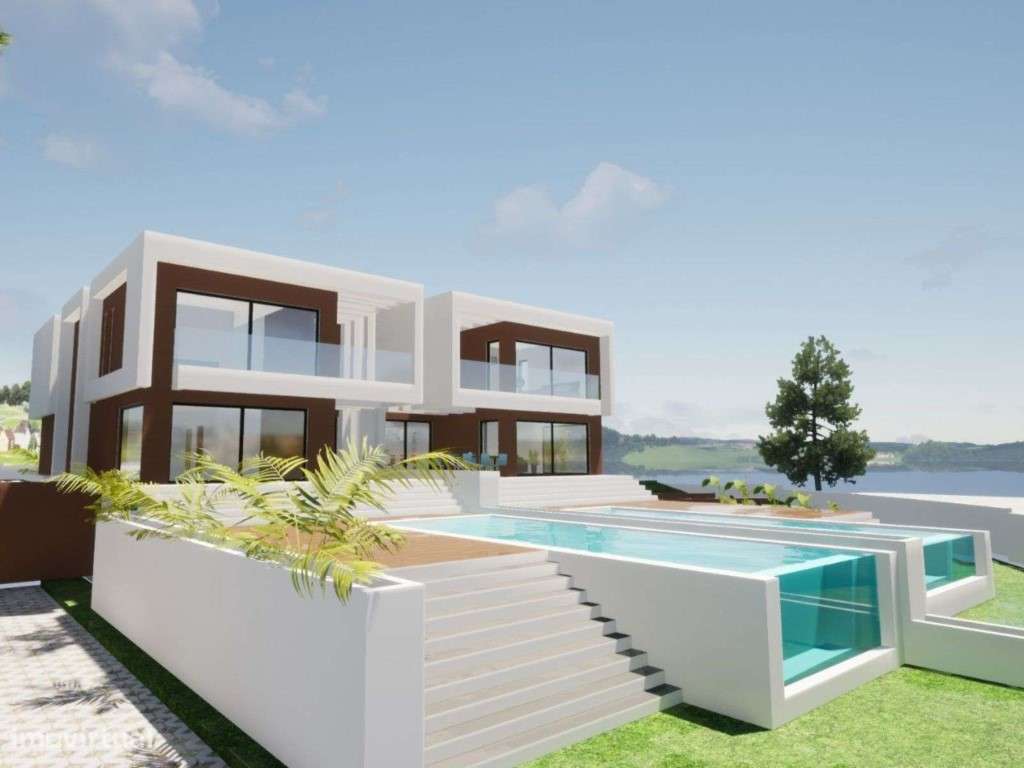 Moradia geminada T4+1 com vista sobre o Rio Sado em Tróia - Grande imagem: 5/44