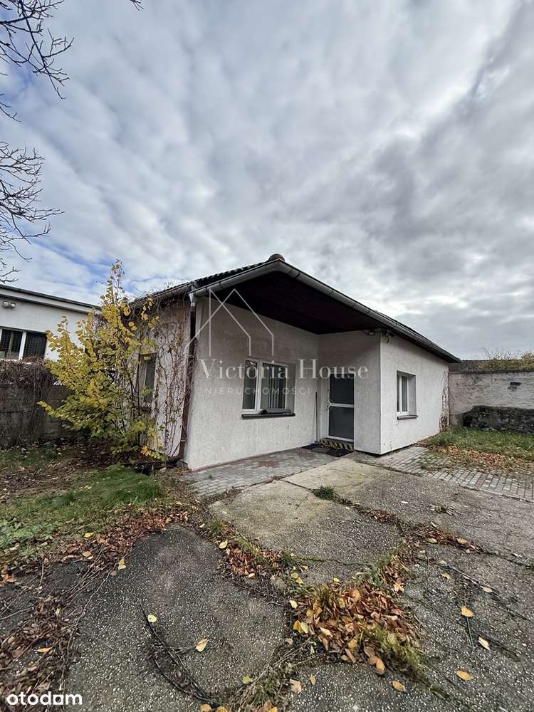 Teren usługowy z zabudowaniami.-8