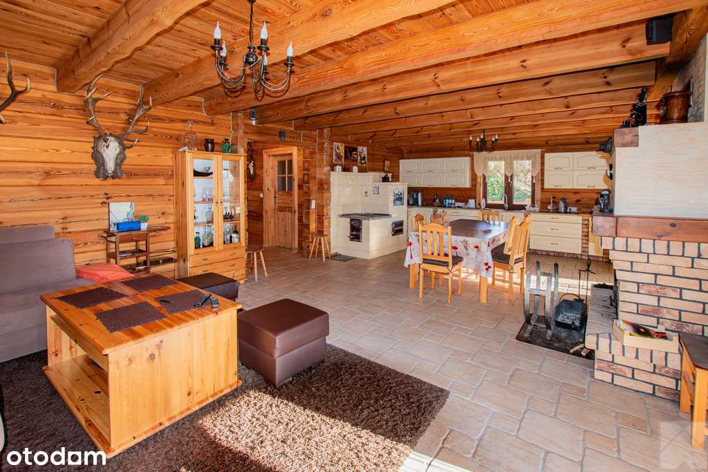 Dom z pełnego bala z zarybionym stawem-9