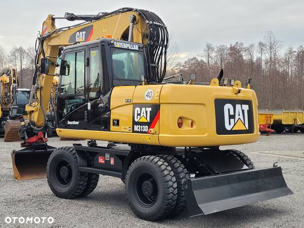 Caterpillar M 313D / ROTOTILT / sprowadzona / - 2