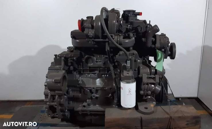 Motor buldoexcavator komatsu wb97s ult-020207 - 1