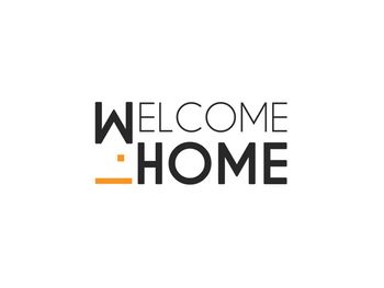 Welcome Home Nieruchomości Logo