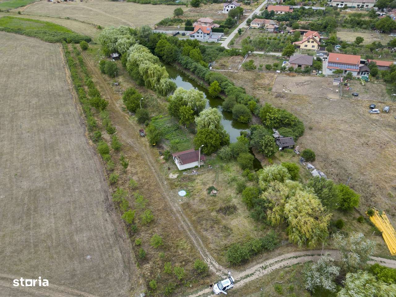 Teren de 7900 mp cu baltă de pescuit în Frumușeni - Imagine principală: 4/13