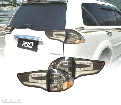 FAROLINS PARA MITSUBISHI MONTERO SPORT 09 LED PRETO - 1