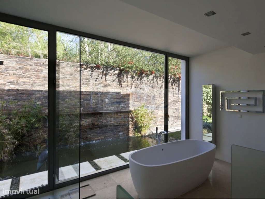 Moradia térrea Contemporânea com 600m2 de área bruta implantada em ...-7