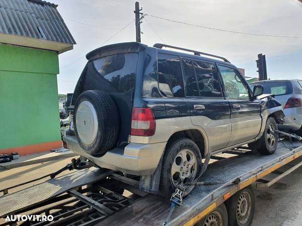 bara spate capota portbagaj haion mocheta rulou oglinda stanga dreapta Mitsubishi Pajero Pinin motor 1.8 benzina dezmembrez - 3