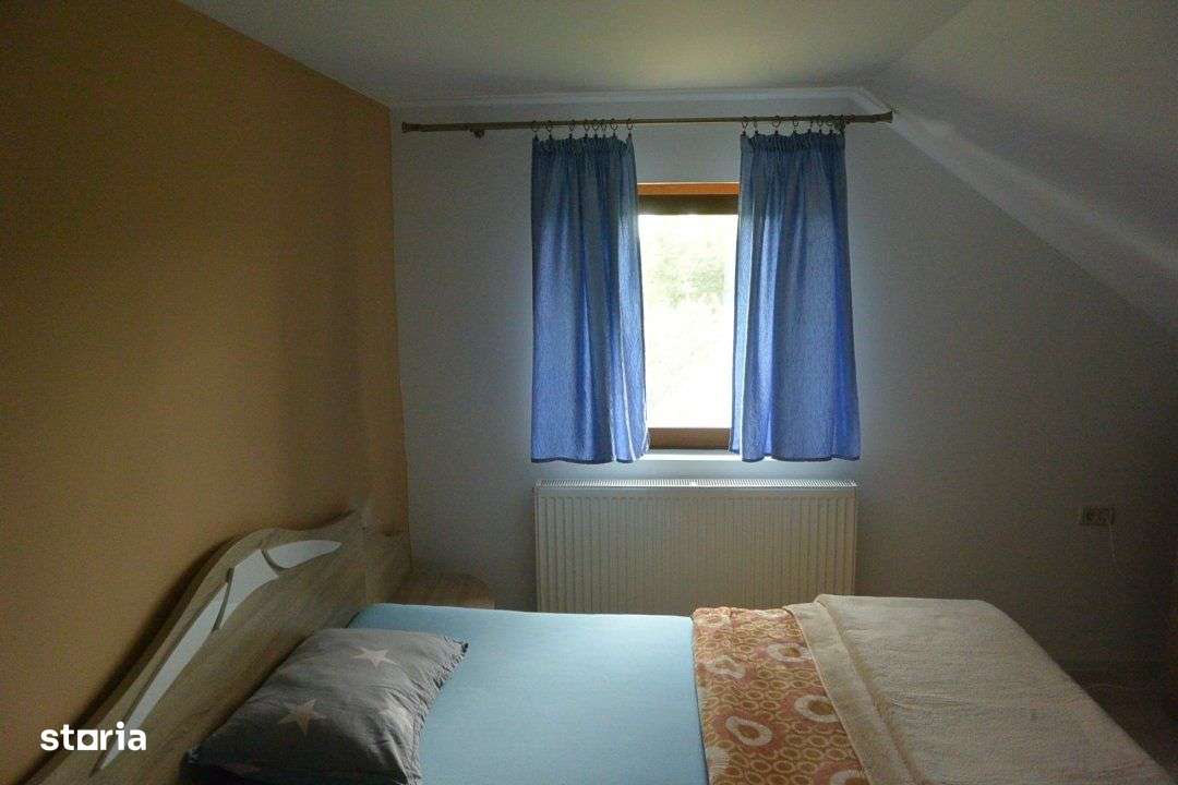 Casa P+E, la 15 km de Poiana Lacului, finisata, mobilata, teren 7500mp - Imagine principală: 4/14