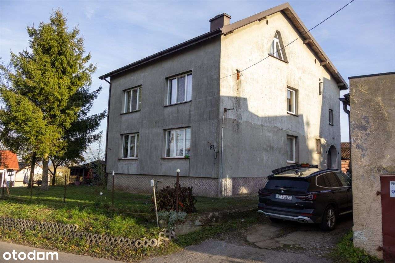 Dom z dwoma mieszkaniami i budynkiem gosp– Szczuka-0