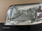 vw transporter t5 lampa lewa przód przednia OE europa 7H1941015N - 3