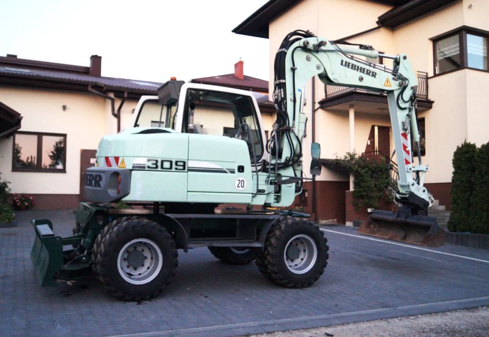 Liebherr 309 litronic / klima / lakier orginał / nowe opony  (311 312 terex cat ) 2013