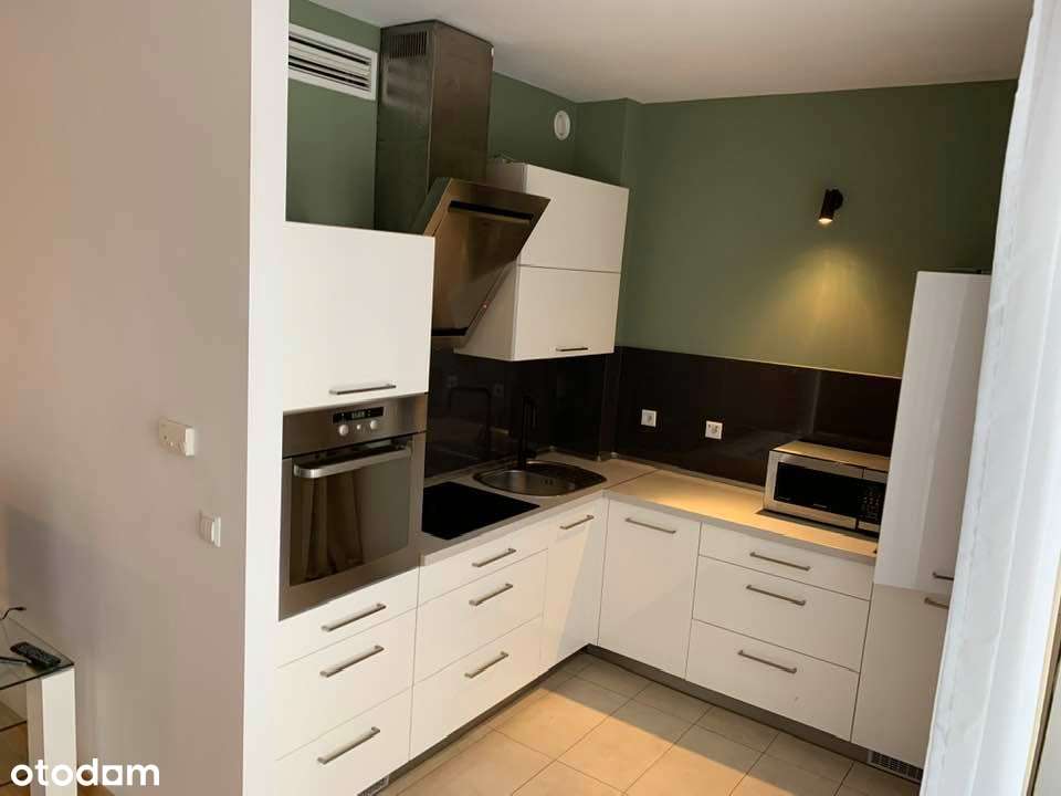 Przestronne 2-pokojowe mieszkanie z balkonem i garażem-1