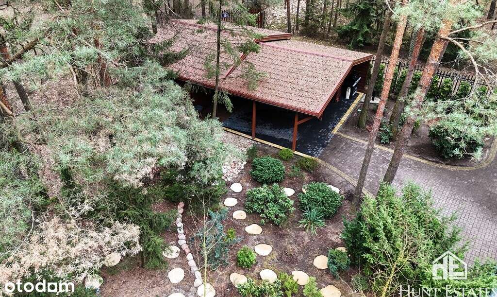 Działka w otoczeniu lasu z domem mieszkalnym i SPA-11