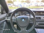 BMW Seria 5 550i - 11