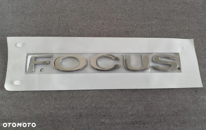 Emblemat znaczek Ford tył napis Focus 2004/Focus C-Max 2003-2007, Focus 2008-2011 1722097 - 1