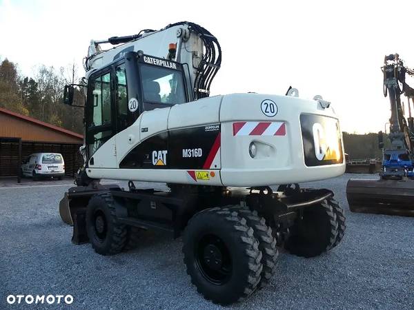 Caterpillar CAT M316D z Niemiec / 12.700mtg / - 6