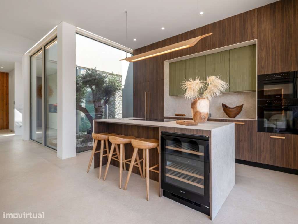 Moradia de extraordinária qualidade junto à lagoa, golfe e praia-9